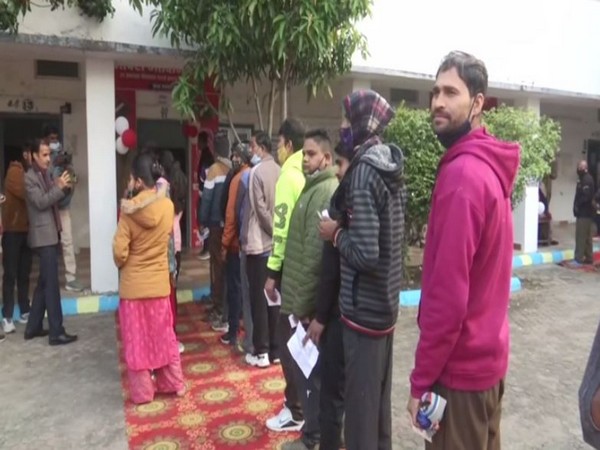 People standing line to caste their vote