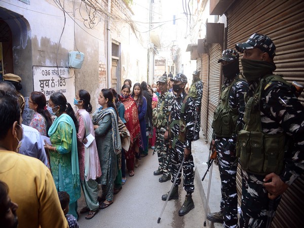 People Standing in queue to cast their vote