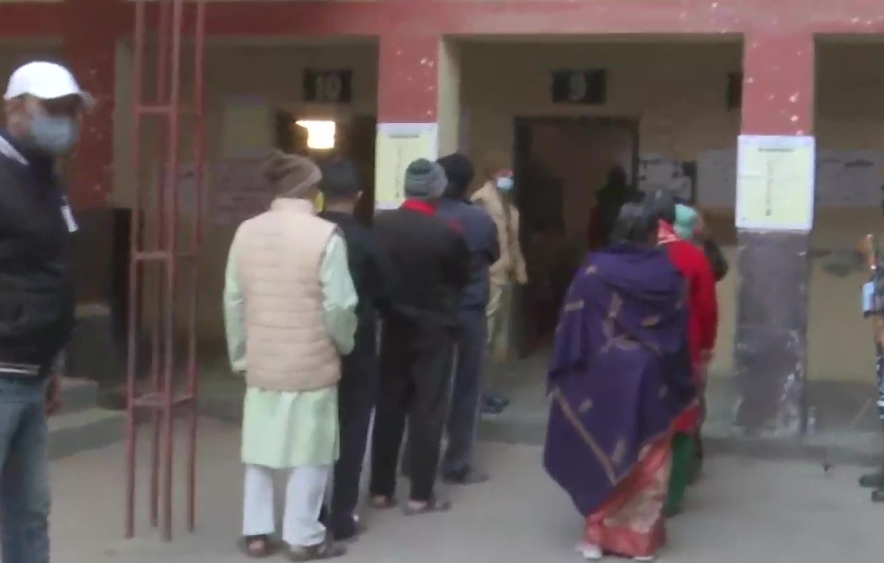 People Standing in queue to cast their vote