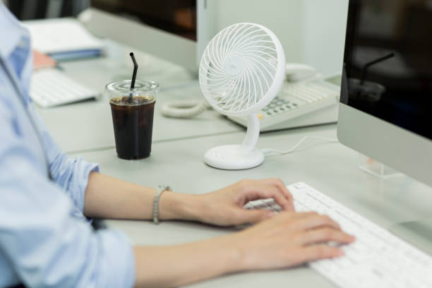 A woman using table fan (File Photo)