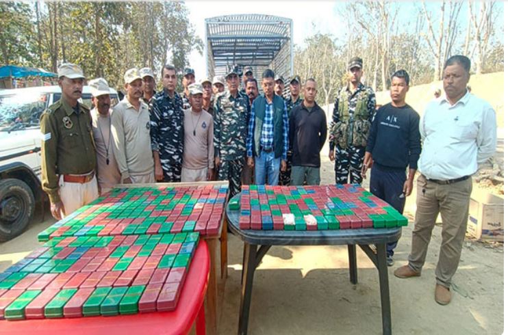 Assam Police, CRPF with the seized Heroin