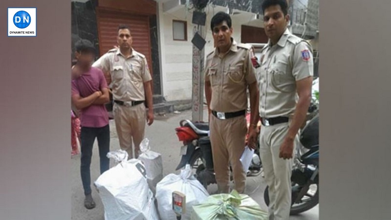 Delhi Police with seized firecrackers and arrested individual