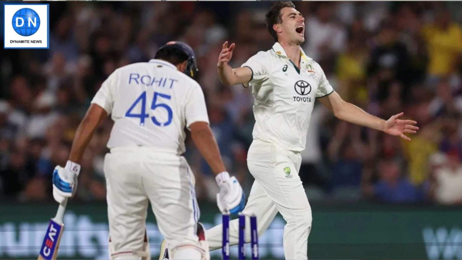 Pat Cummins celebrates the dismissal of Rohit Sharma