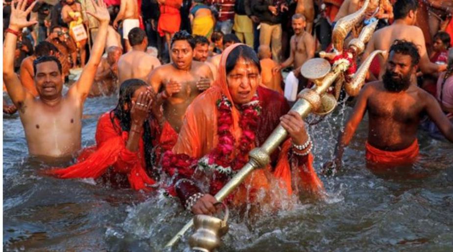 Devotees take a dip in Ganga