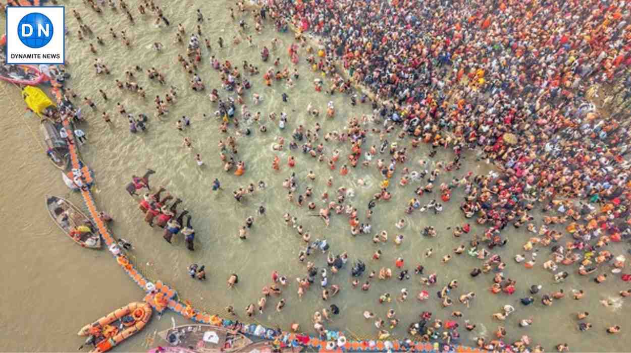 A photo of devotees taking a dip in the Triveni Sangam at Maha Kumbh Mela