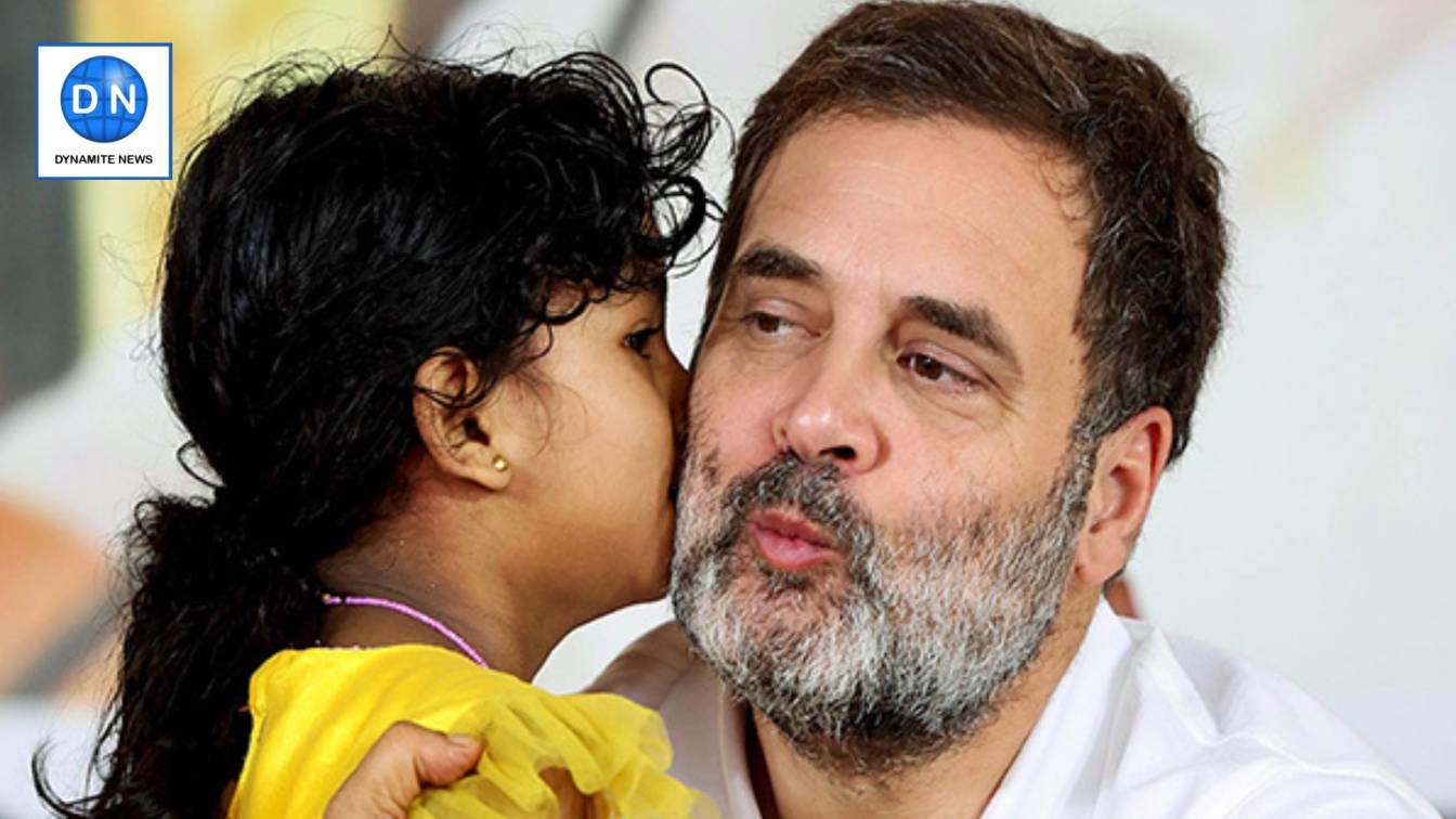 Congress leader Rahul Gandhi shares a light moment with a girl during public meeting